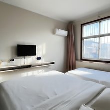 新泰佳信宾馆(楼德汽车站店)