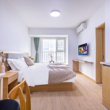 青岛汩梓公寓(万达广场卓越大融城店)