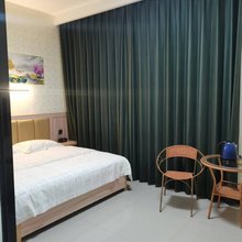 巴马新怡商务酒店