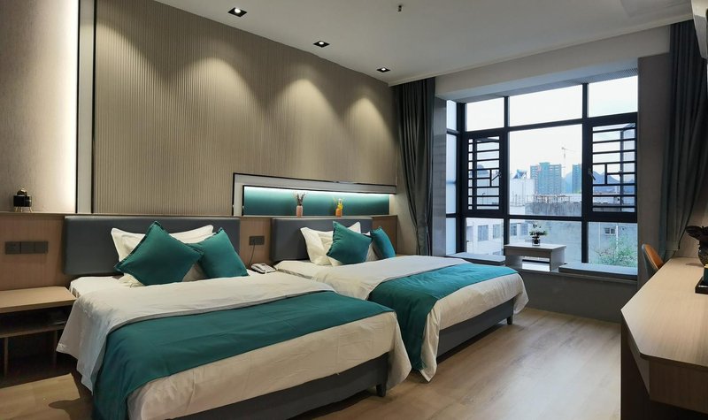 Chunjiang Business Hechi Baima Street Guest Room
