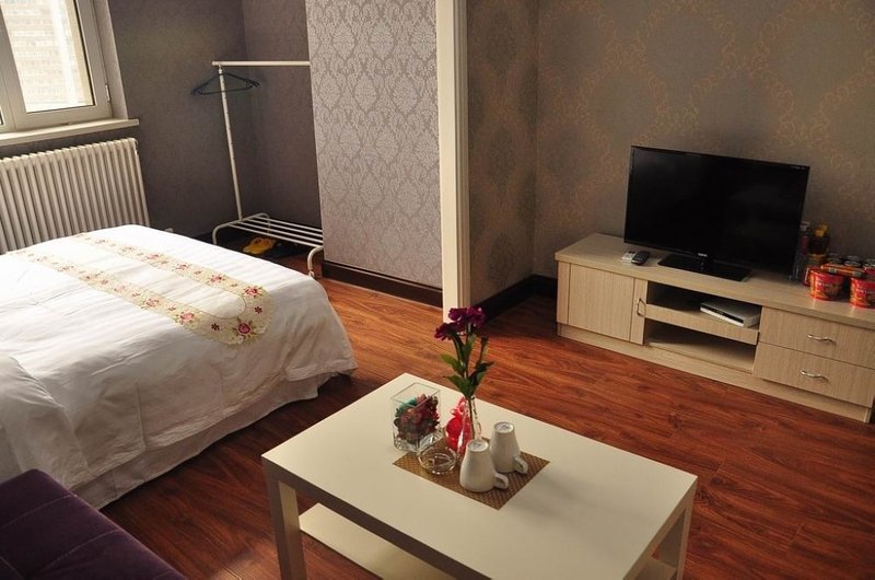 Haizhongjin Apartment Hotel (Dalian Zhongshan Plaza Minzhu Branch) Guest Room