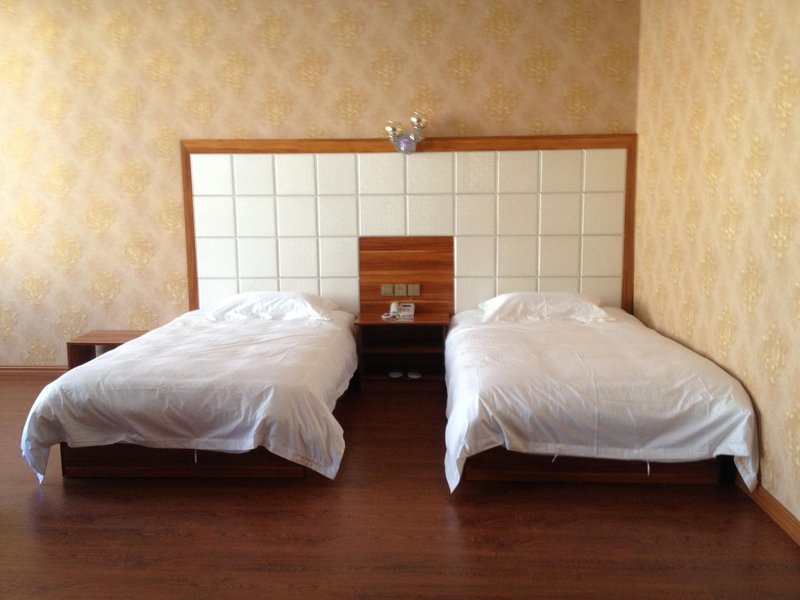 qiqihaerqiandeshangwubinguan Guest Room