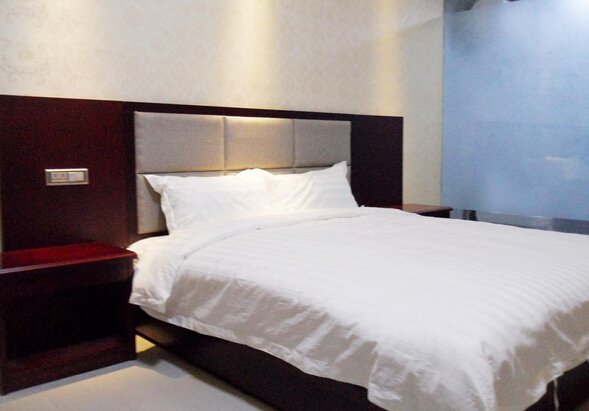 The League of nations Business Hotel Guest Room