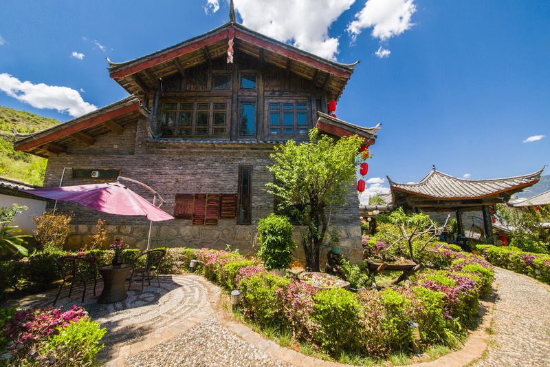 THE TANGSHE COZY HUT INN Over view