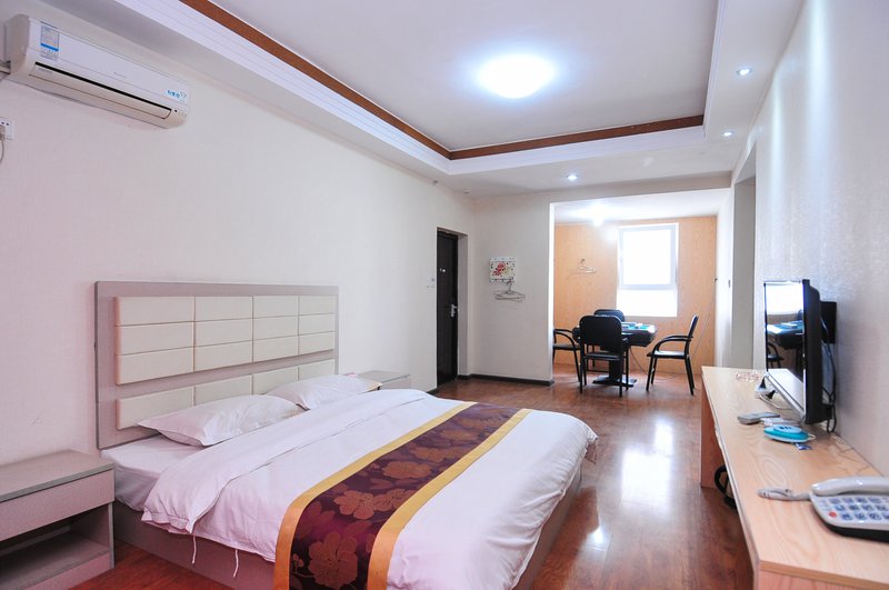 Xishuangbanna Baolong Business Hotel Guest Room