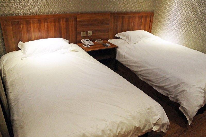 qiqihaerqiandeshangwubinguan Guest Room