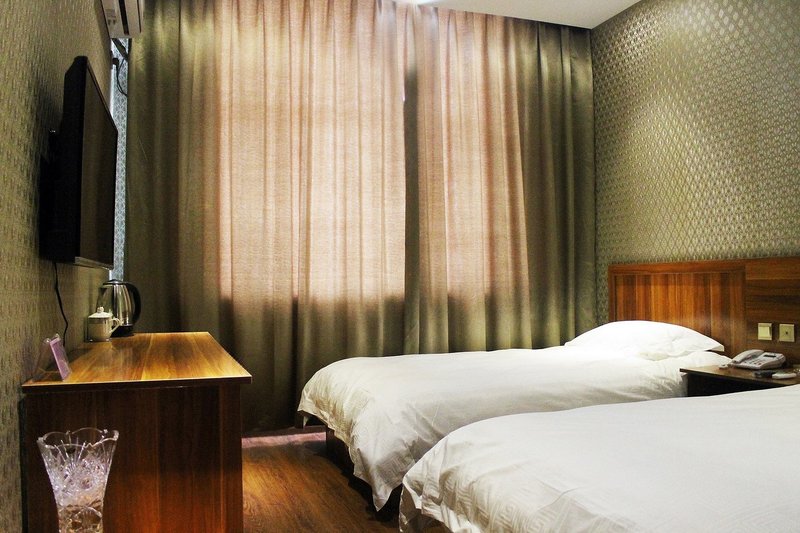 qiqihaerqiandeshangwubinguan Guest Room