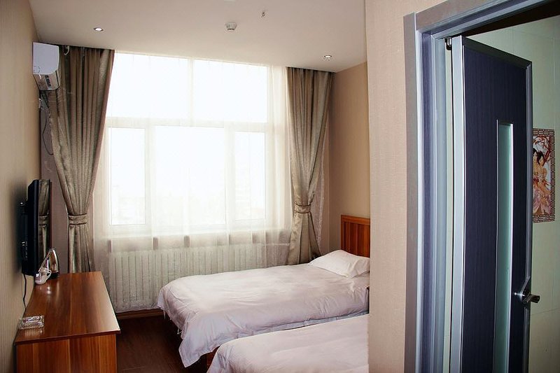 qiqihaerqiandeshangwubinguan Guest Room