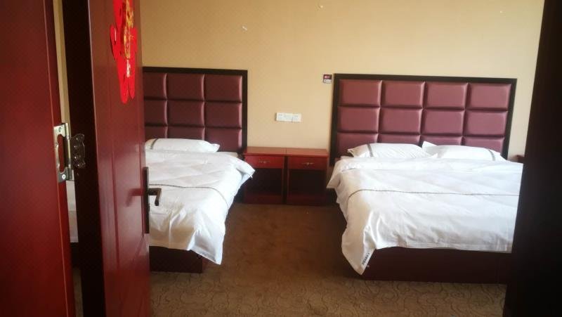 Huitong Shengshi Business Hote Guest Room